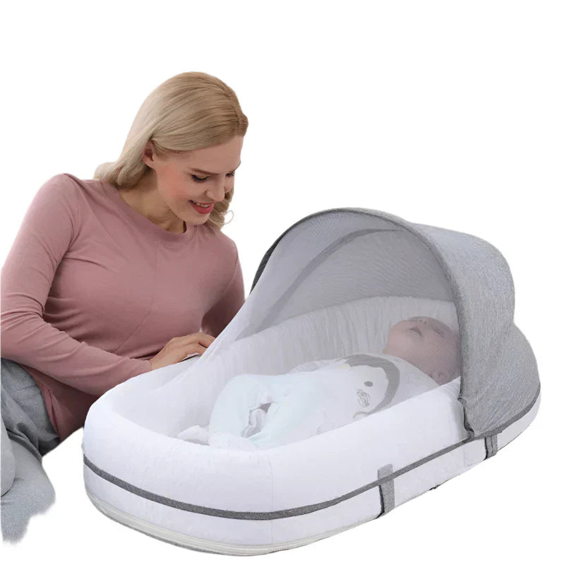 Babynest mit Moskitonetz